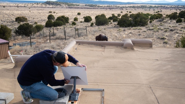 A homeowner installs a Starlink satellite internet system in Galisteo, New Mexico, US. Starlink is a satellite-based internet provider owned by SpaceX.