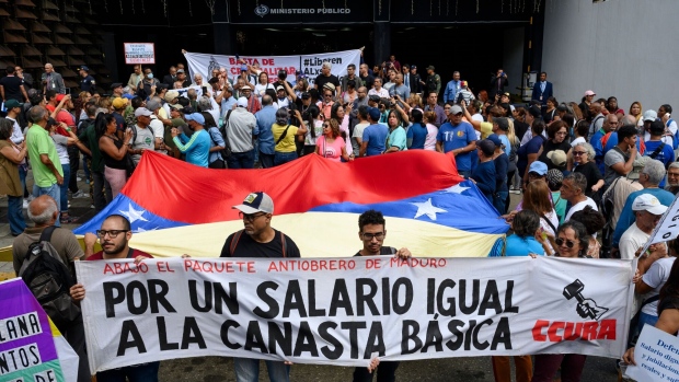 Demonstrators during a protest in support of public sector workers outside the Public Ministry of Venezuela headquarters in Caracas, Venezuela, on Tuesday, Jan. 9, 2024.