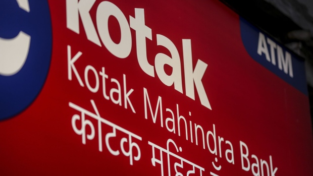Signage for Kotak Mahindra Bank Ltd. is displayed outside a branch in Mumbai, India, on Saturday, April 21, 2018. Kotak Mahindra is scheduled to announce fourth-quarter earnings on April 30. Photographer: Dhiraj Singh/Bloomberg
