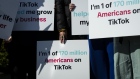 <p>Tik Tok creators and advocates hold signs before a news conference outside the US Capitol.</p>