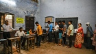 Voters queue at a polling station during the fourth phase of voting for national elections in Kanpur, Uttar Pradesh, on May 13.
