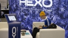 An attendee uses a laptop at the Hexo Corp. booth during the Montreal Cannabis Expo in Montreal, Que