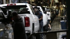Workers inspect General Motors Co. (GM) Chevrolet 2019 Silverado HD and 2019 GMC Sierra HD pickup trucks on the assembly line at the GM plant in Flint, Michigan, U.S., on Tuesday, Feb. 5, 2019. GM is selling lots of expensive pickup trucks and sport utility vehicles in the U.S., which helped its average vehicle sales price hit a record $36,000. That played a big role in the better-than-expected quarterly earnings. 