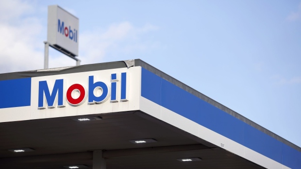 Signage is displayed at an Exxon Mobil Corp. gas station in Columbus, Indiana, U.S., on Tuesday, Jan. 29, 2019. Soaring production in North America's most prolific oil field helped propel Exxon Mobil Corp. to bigger-than-expected fourth-quarter profits. Photographer: Luke Sharrett/Bloomberg