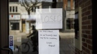 A closed sign is displayed on the door of a store on Queen St. in Toronto, Ontario, Canada, on Wednesday, March 25, 2020. The unemployment rate in Ontario, which accounts for almost 40% of Canada’s output, was running at close to a record low before the province ordered all but essential businesses to shut down in a bid to contain the virus. Ontario now sees zero growth for this year. Photographer: Cole Burston/Bloomberg