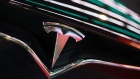 The Tesla Inc. logo is seen on the grille of a Model X electric vehicle at the Moscow Tesla Club in Moscow, Russia, on Friday, July 20, 2018. Tesla may nearly double the number of cars it�s selling in Russia after a mobile-phone retailer backed by billionaire Alisher Usmanov unexpectedly added electric vehicles to the line of gadgets it offers. MegaFon PJSC, said it received orders for 236 vehicles in June, the first month it started sales jointly with importer Moscow Tesla Club. Photographer: Andrey Rudakov/Bloomberg