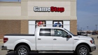A truck sits parked outside a GameStop Corp. store in Oswego, Illinois, U.S., on Monday, April 1, 2019. GameStop is scheduled to release earnings figures on April 2.