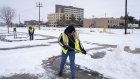 Workers clear snow from a parking lot in Midland, Texas, U.S, on Monday, Feb. 15, 2021. Blackouts triggered by frigid weather have spread to more than four million homes and businesses across the central U.S. and extended into Mexico in a deepening energy crisis that's already crippled the Texas power grid. Photographer: Matthew Busch/Bloomberg