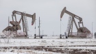 Pumpjacks operate in the snow in the Permian Basin in Midland, Texas, U.S, 