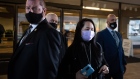 Meng Wanzhou, chief financial officer of Huawei Technologies Co., center, exits Supreme Court after a hearing in Vancouver, British Columbia, Canada, on Friday, Jan. 29, 2021. Meng's request to loosen the bail terms set during her release from jail in 2018 has been rejected, a Canadian judge ruled on Friday, as she fights a U.S. extradition case.