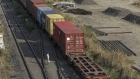 A train transporting shipping containers travels along a track near the Jawaharlal Nehru Port, operated by Jawaharlal Nehru Port Trust (JNPT), in Navi Mumbai, Maharashtra, India, on Monday, March 30, 2020. As billions of people stay home in the the world's major economic centers, consumption of everything from transport fuel to petrochemical feedstocks is in freefall. Refiners that have already been filling up their storage tanks with unsold products now have little choice but to partially shut down their plants. Photographer: Dhiraj Singh/Bloomberg