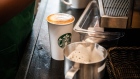 A barista prepares a customers coffee order inside a Starbucks cafe in the Sandton area of Johannesburg.