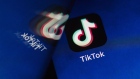 ByteDance Ltd.'s TikTok app button, reflected in a mirror, is arranged for a photograph on a smartphone in Sydney, New South Wales, Australia, on Monday, Sept. 14, 2020. Oracle Corp. is the winning bidder for a deal with TikTok’s U.S. operations, people familiar with the talks said, after main rival Microsoft Corp. announced its offer for the video app was rejected. Photographer: Brent Lewin/Bloomberg