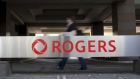 Signage is displayed outside Rogers Communications Inc. headquarters in Toronto, Ontario, Canada, on Wednesday, May 17, 2017. Rogers Communications, Canada's largest wireless carrier, is leveraging organic growth in the country's wireless market to expand its subscriber base. Photographer: Brent Lewin/Bloomberg