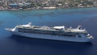 A cruise ship pulls into George Town, the capital of Grand Cayman. Photographer: David Rogers/Getty Images South America
