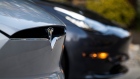 A Tesla Inc. badge is displayed on a Model X electric vehicle in San Ramon, California, U.S., on Saturday, Feb. 8, 2020. Tesla Chief Executive Officer Elon Musk is pushing the Solar Roof and batteries as essential components of the company's drive to reduce fossil fuel use. Photographer: David Paul Morris/Bloomberg