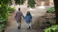 An elderly couple holds hands while walking on a path at Golden Gate Park in San Francisco, California, U.S., on Thursday, June 21, 2018. The Labor Department rule, aka the fiduciary rule conceived by the Obama administration, was meant to ensure that advisers put their clients' financial interests ahead of their own when recommending retirement investments has been killed by the Trump administration. Photographer: David Paul Morris/Bloomberg