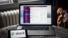The Slack Technologies Inc. program on a laptop computer and the company logo on a smartphone arranged in Dobbs Ferry, New York, U.S., on Saturday, May 29, 2021. Slack Technologies Inc. is scheduled to release earnings figures on June 3. Photographer: Tiffany Hagler-Geard/Bloomberg