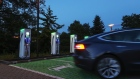 A Tesla Inc. Model 3 electric automobile departs after charging at an electric vehicle refueling site, operated by Enercity AG, in Hanover, Germany, on Thursday, July 23, 2020. Europe’s largest car market is rolling out a nationwide electric car charging infrastructure by 2030 in an effort to rein in transport emissions. Photographer: Alex Kraus/Bloomberg