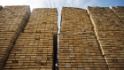 Softwood lumber sits in stacks at the Groupe Crete Inc. sawmill in Chertsey, Quebec, Canada, on Tuesday, Sept. 4, 2018. Lumber futures for November delivery rose $12.10, or 3%, to $414.70 per 1,000 board feet on the Chicago Mercantile Exchange after jumping by the maximum.