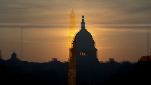 The Washington Monument through a reflection of the U.S. Capitol in Washington, D.C. Photographer: Stefani Reynolds/Bloomberg