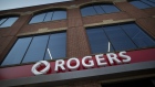 Signage is displayed on the exterior of a Rogers Communications Inc. store in Toronto, Ontario, Canada, on Wednesday, May 17, 2017. Rogers Communications, Canada's largest wireless carrier, is leveraging organic growth in the country's wireless market to expand its subscriber base. Photographer: Brent Lewin/Bloomberg