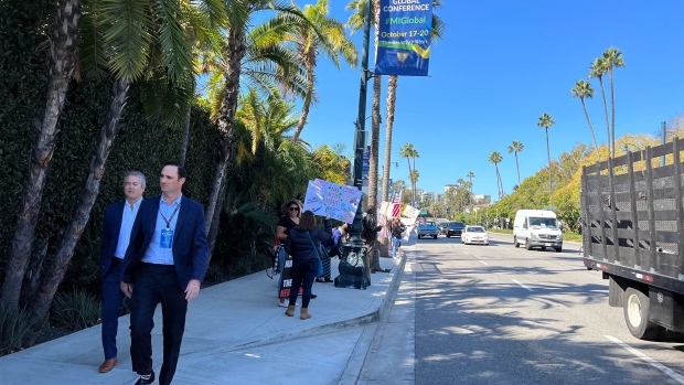 Anti-vaxxers outside the Milken conference on Oct. 19.