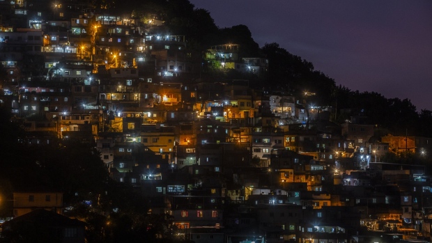 Lights illuminate buildings at night in Rio de Janeiro, Brazil, on Monday, May 24, 2021. Brazil's lower house approved the main text of a bill that paves the way for the privatization of state utility Eletrobras. Photographer: Dado Galdieri/Bloomberg