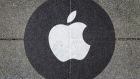 An Apple Inc. logo social distance marker on the pavement outside a store in San Francisco, California, U.S., on Friday, Oct. 23, 2020. The iPhone 12 and iPhone 12 Pro went on sale in stores, but with individual shopping sessions replacing the famous lines and crowds around locations.