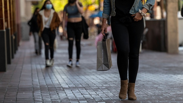 A shopper wearing a protective mask carries a Nordstrom Inc. shopping bag in San Francisco, California, U.S., on Thursday, June 10, 2021. Prices paid by U.S. consumers rose in May by more than forecast, extending a months-long buildup in inflation that risks becoming more established as the economy strengthens. Photographer: David Paul Morris/Bloomberg