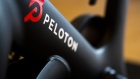 A Peloton logo on a stationary bike at the company's showroom in Dedham, Massachusetts, U.S., on Wednesday, Feb. 3, 2021. Peloton Interactive Inc. is scheduled to release earnings figures on February 4. Photographer: Adam Glanzman/Bloomberg
