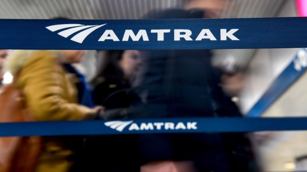Travelers stand on line to board an Amtrak train at Pennsylvania Station in New York, U.S., on Thursday, Feb. 28, 2019. Amtrak, along with three New York City-area mass-transit agencies and two members of the U.S. House of Representatives, say there is no known alternative plan should the Hudson River tunnel close, cutting off the national railroad's busiest route and blocking thousands from their workplaces. Photographer: Ron Antonelli/Bloomberg