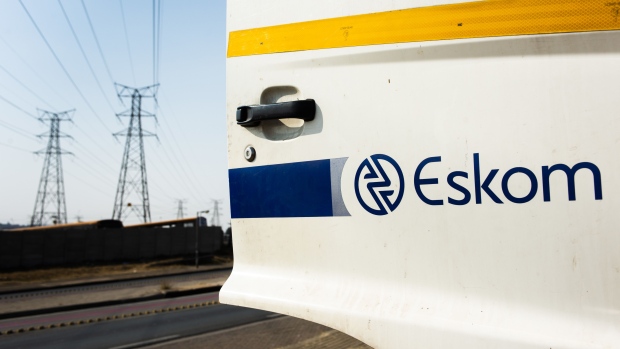A company logo sits on an Eskom Holdings SOC Ltd. maintenance truck door in Soweto, South Africa, on Tuesday, Aug. 8, 2019. Eskom, South Africa’s biggest polluter, said emissions of particulate matter that cause chronic respiratory disease are at their highest level in two decades as the state power utility’s financial meltdown has seen it skip maintenance and has triggered strikes.