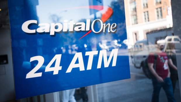 A sign for an automated teller machine (ATM) is displayed in the window of a Capital One Financial Corp. bank branch in New York, U.S., on Friday, Oct. 14, 2016. Capital One Financial Corp. is scheduled to release earnings figures on October 25. Photographer: Mark Kauzlarich/Bloomberg