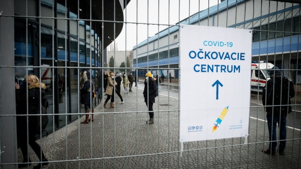 People wait for their family members at the vaccination centre at the National Football Stadium on March 21, 2021 in Bratislava, Slovakia. 