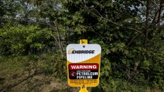 Signage for an underground Enbridge pipeline in Sarnia, Ontario, Canada, on Tuesday, May 25, 2021. Enbridge Inc. said it will continue to ship crude through its Line 5 pipeline that crosses the Great Lakes, despite Michigan Governor Gretchen Whitmer's order to shut the conduit. Photographer: Cole Burston/Bloomberg