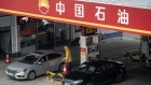 Vehicles refuel at a PetroChina Co. gas station in Shanghai, China, on Thursday, Jan. 7, 2021. China's energy markets are tightening as the economy rebounds and freezing weather grips much of the northern hemisphere, a dynamic that’s likely to be exacerbated by reduced Saudi oil output.
