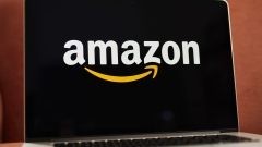 The logo for Amazon.com Inc. is displayed on an Apple Inc. laptop computer in an arranged photograph taken in the Brooklyn borough of New York, U.S., on Friday, April 10, 2020. Across the country, millions of consumers are turning to Amazon.com and other services to fill their fridges via online delivery rather than brave going to a supermarket because of shelter-in-place declarations during the coronavirus pandemic. Photographer: Gabby Jones/Bloomberg