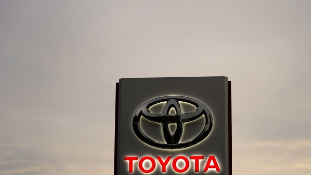 Toyota Motor Co. signage is displayed outside a dealership at dusk in Tokyo, Japan, on Sunday, May 10, 2020. Global automakers and suppliers are on track to get at least $100 billion of bank financing as the coronavirus pandemic hammers car sales. Photographer: Toru Hanai/Bloomberg