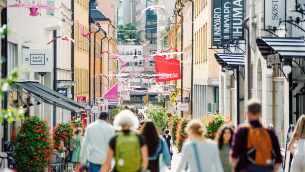 Pedestrians walk down a shopping street in Stockholm, Sweden, on Thursday, Aug. 6, 2020. Sweden was unable to escape its worst economic contraction ever despite adopting one of Europe’s softest approaches to the Covid-19 pandemic.