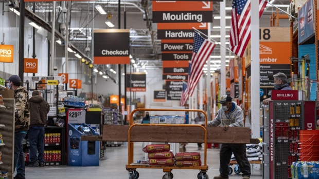 A shopper wearing a protective mask waits to check out at a Home Depot store in Pleasanton, California, U.S., on Monday, Feb. 22, 2021. Home Depot Inc. is expected to release earnings figures on February 23.