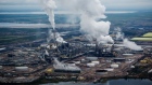 Steam rises from an upgrader plant in the Athabasca oil sands near Fort McMurray, Alberta.