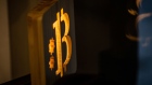 An illuminated wooden Bitcoin logo inside a cryptocurrency exchange in Barcelona, Spain, on Wednesday, March 9, 2022. Bitcoin dropped back below $40,000, erasing almost all the gains sparked by optimism about U.S. President Joe Biden’s executive order to put more focus on the crypto sector. Photographer: Angel Garcia/Bloomberg