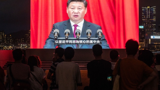 A screen shows Chinese President Xi Jinping speaking at a light show marking the centenary of the Chinese Community Party and the anniversary of Hong Kong's return to Chinese rule at Tamar Park in Hong Kong, China, on Thursday, July 1, 2021. Hong Kong's leader pledged to press ahead with an unprecedented national security crackdown, as the Asian financial center marked a series of fraught anniversaries symbolizing Beijings tightening grip over local affairs.