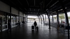 A traveler walks toward a taxi stand at Sydney Airport in Sydney, Australia, on Monday, Feb. 21, 2022. Australia reopened its international borders to double-vaccinated visitors today, following almost two years of strict travel bans introduced to stem the spread of Covid-19. Photographer: Brent Lewin/Bloomberg