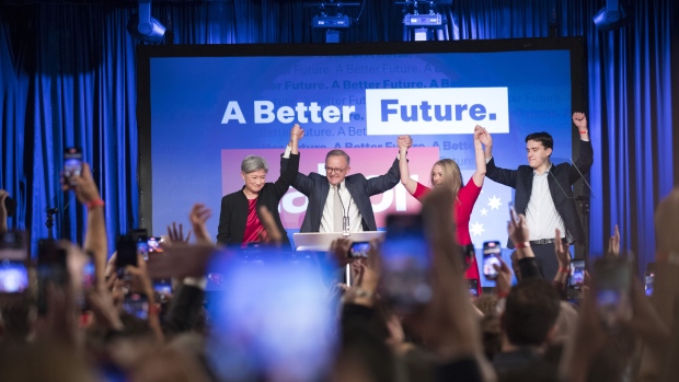 Anthony Albanese, leader of the Labor Party, center, speaks while his partner Jodie Haydon, left, and his son Nathan Albanese stand on stage during the party's election night event in Sydney, Australia, on Saturday, May 21, 2022. Australia's Labor Party is set to take power for the first time since 2013, as voters booted out Prime Minister Scott Morrison's conservative government in a shift likely to bring greater action on climate change and a national body to fight corruption. Photographer: Brent Lewin/Bloomberg