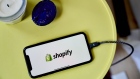 The Shopify logo on a smartphone arranged in the Brooklyn borough of New York, U.S., on Wednesday, Feb. 16, 2022. Shopify Inc. plunged the most in almost two years after giving a weaker outlook for growth this year, as online spending resets after the Covid-19 induced boom and consumers face higher inflation. Photographer: Gabby Jones/Bloomberg