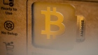 A Bitcoin logo on a physical cryptocurrency wallet inside a BitBase cryptocurrency exchange in Barcelona, Spain, on Monday, May 16, 2022. The wipeout of algorithmic stablecoin TerraUSD and its sister token Luna knocked more than $270 billion off the crypto sector’s total trillion-dollar value in the most volatile week for Bitcoin trading in at least two years. Photographer: Angel Garcia/Bloomberg