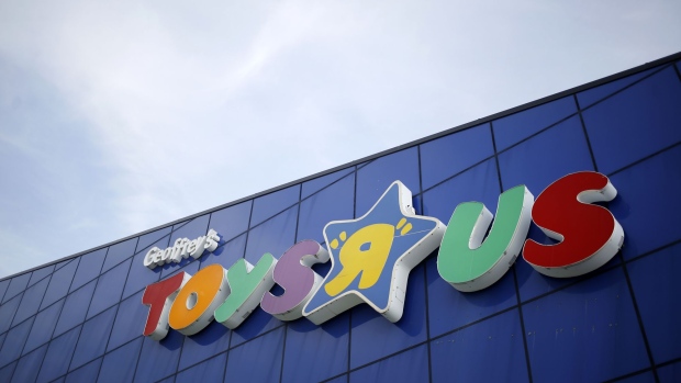 Signage is displayed outside a Toys R Us Inc. retail store in Louisville, Kentucky, U.S., on Monday, Sept. 18, 2017. Toys R Us Inc., which has struggled to lift its fortunes since a buyout loaded the retailer with debt more than a decade ago, is preparing a bankruptcy filing as soon as today, according to people familiar with the situation. Photographer: Luke Sharrett/Bloomberg