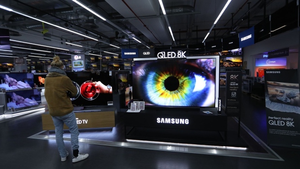 A Samsung Electronics Co. QLED 8K television sits on display in the home entertainment section inside a Media Markt electronic goods store, operated by Ceconomy AG, in Berlin, Germany, on Monday, Dec. 17, 2018. Ceconomy announce full year earnings figures on Dec. 19. Photographer: Krisztian Bocsi/Bloomberg
